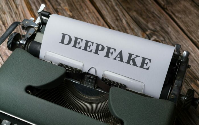 Free A typewriter with the word deepfake on it Stock Photo