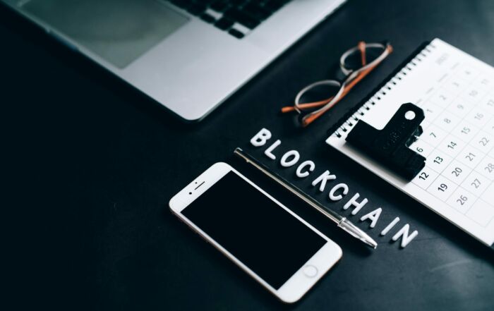 Free Flat lay of a modern digital workspace with blockchain theme, featuring a smartphone and calendar. Stock Photo